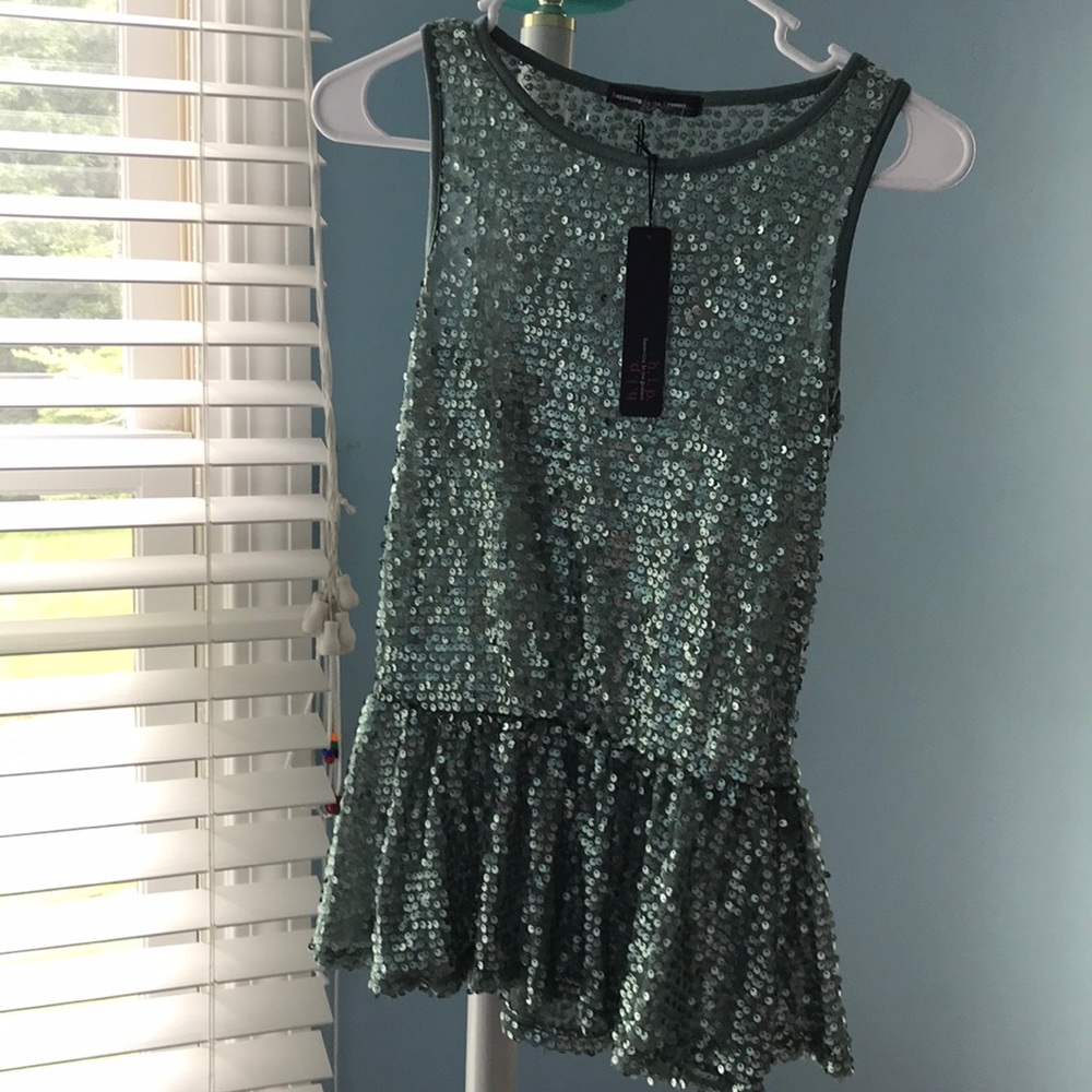 Deep mint sequin top with peplum.